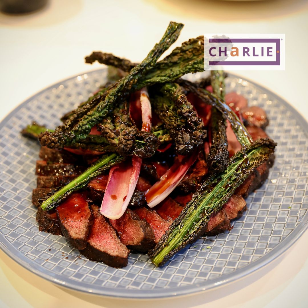 Charcoal cuisine roast venison with crispy cavelo nero cooked over charcoal and juniper bush in the Charlie Oven