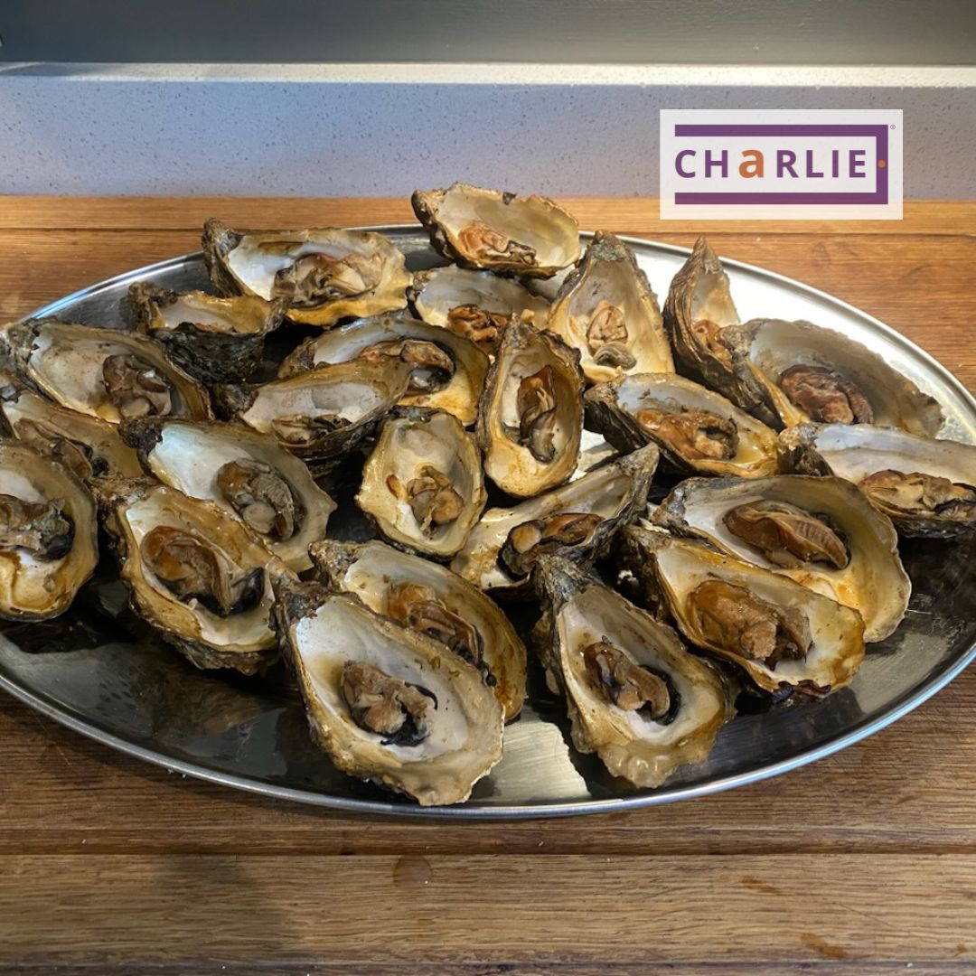 Fresh oysters going into the charlie oven to be hot smoked over cherry wood in the Charlie Charcoal Oven