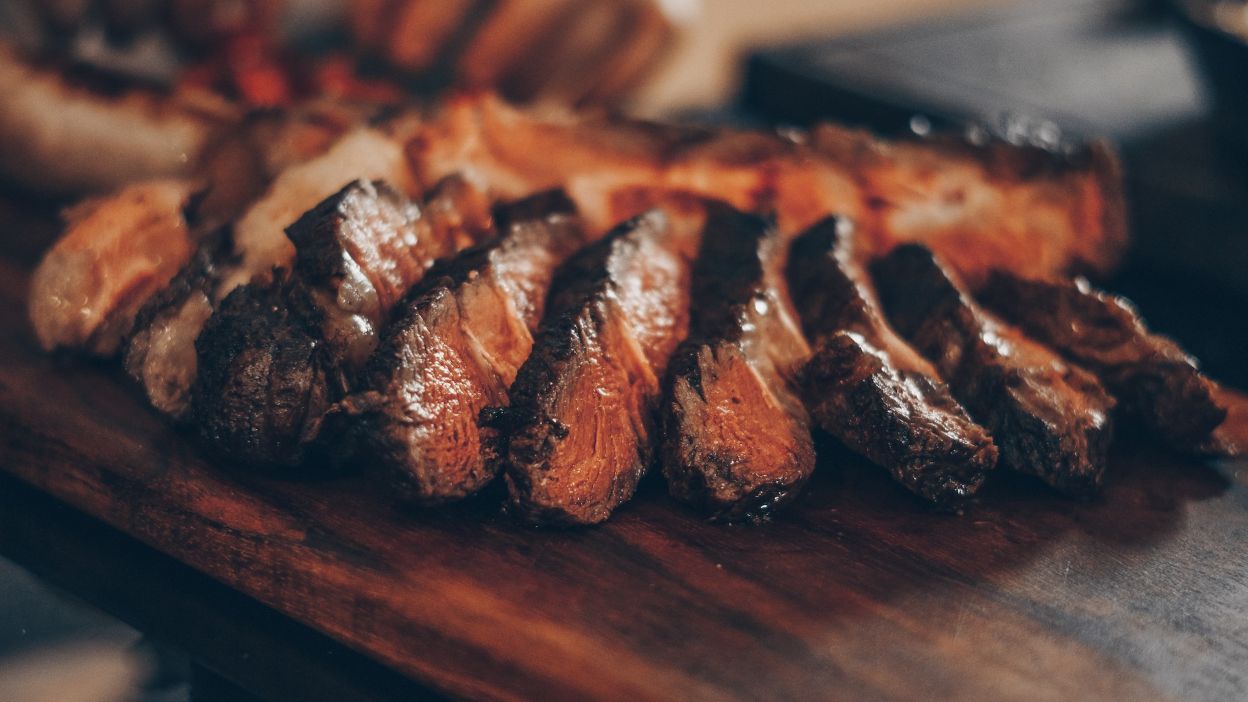 Sliced skirt steak on a cutting board