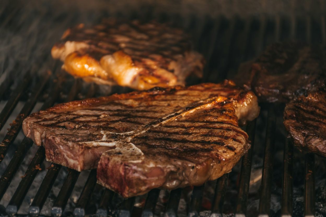 A T-bone steak on a grill
