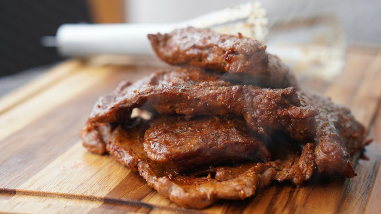 Grilled pork steaks on a cutting board