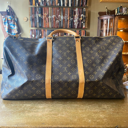 LOUIS VUITTON Travel bag with bag holder, circa 1990 Mon…