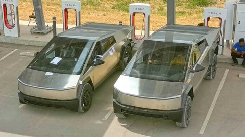 Cybertrucks charging at a Tesla supercharger