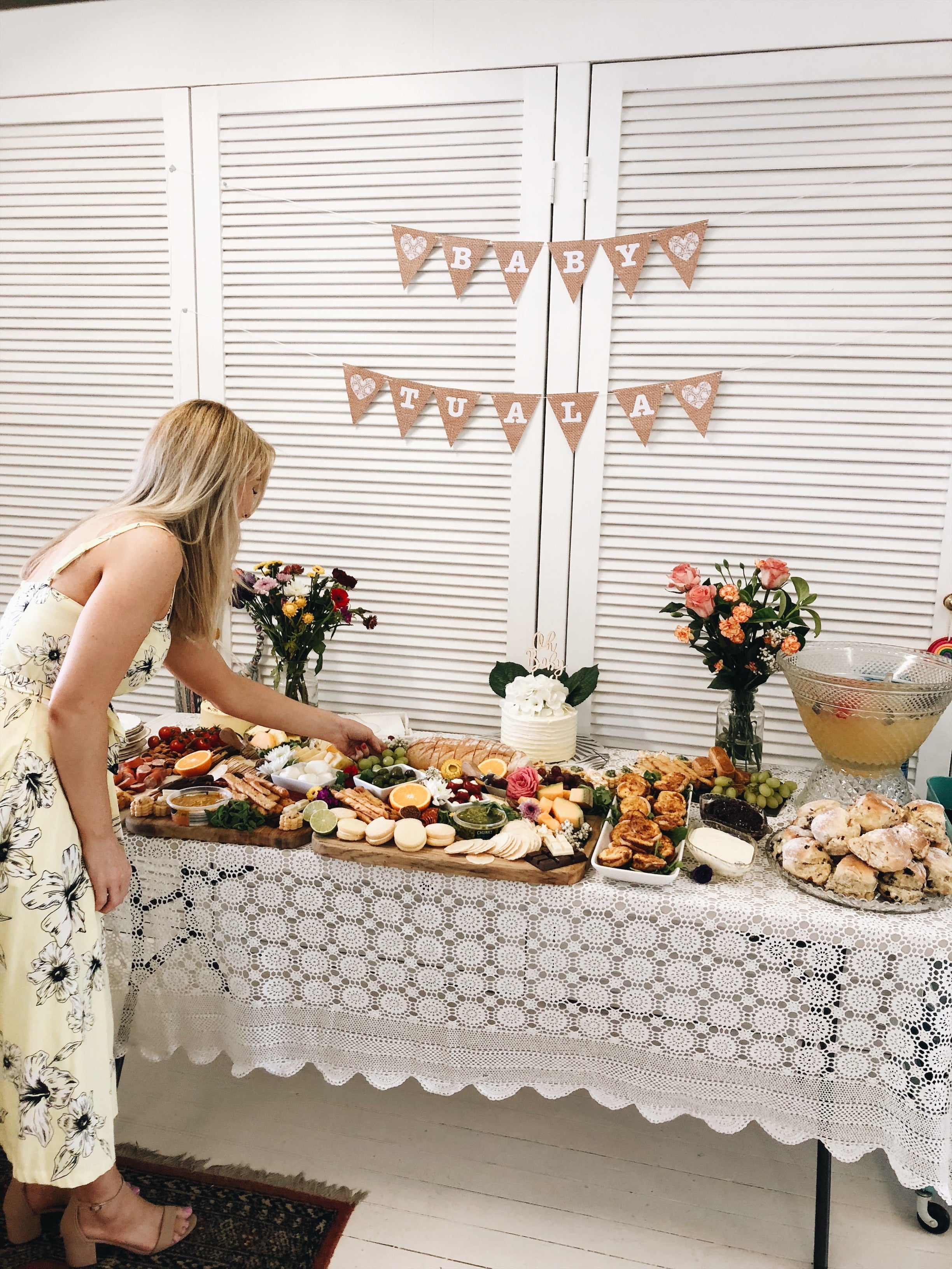 Girl enjoying delicious food platter at crafty baby shower