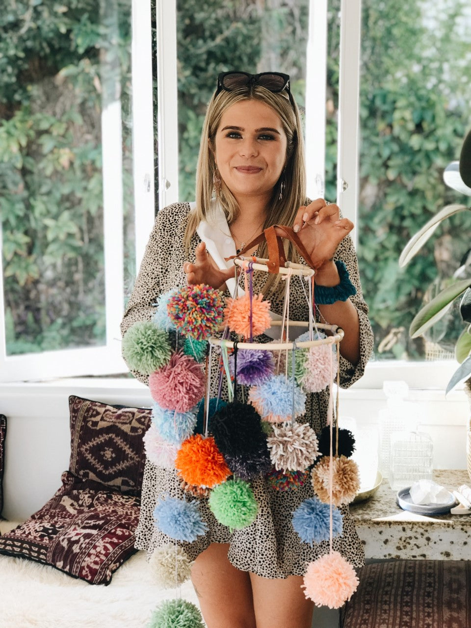 Mum-to-be at her bridal shower with handmade pom pom hanger