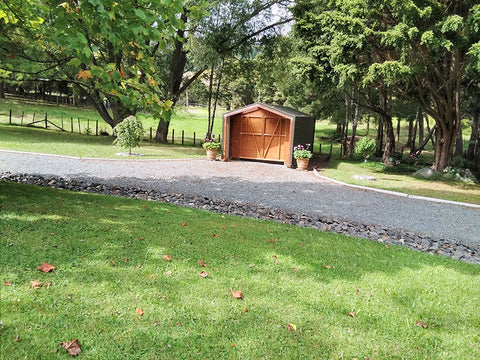 Borderland Shed wood stained and Colorsteel