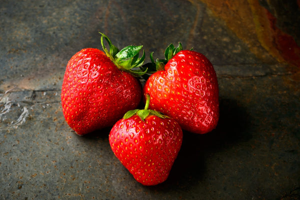 Three ripe strawberries