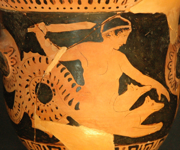 depiction of the Scylla is drawn as a woman with a tail and dog heads sprouting from her body and is painted on a red-figure bell-crater