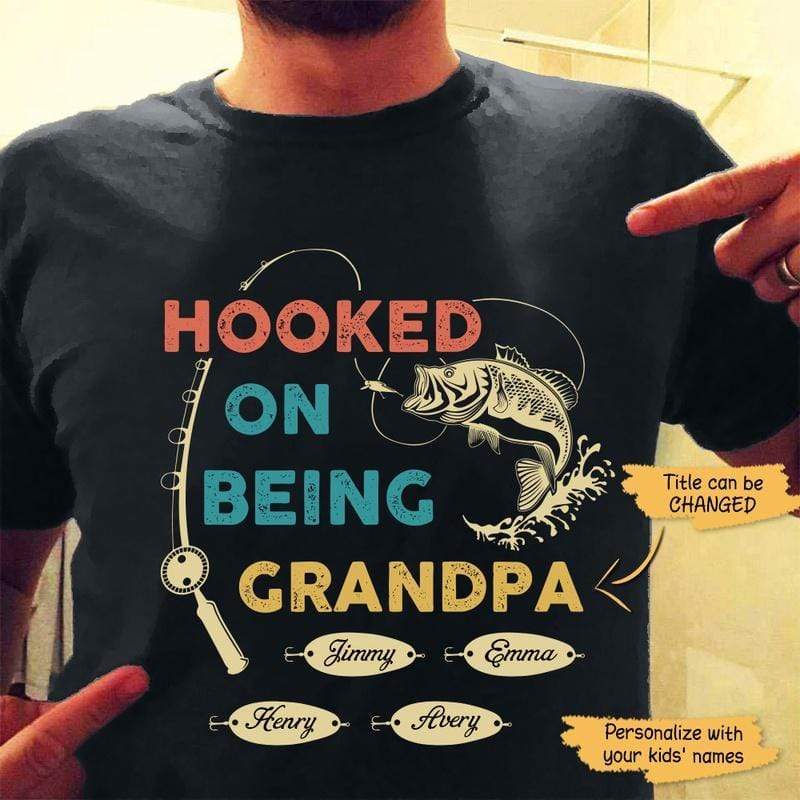 https://cdn.shopify.com/s/files/1/0611/6655/1228/products/apparel-hooked-by-being-fishing-personalized-shirt-classic-tee-black-classic-tee-s-13856261472320.jpg?v=1659359879