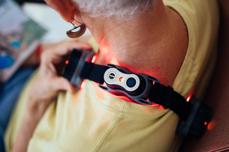 Woman using red light therapy