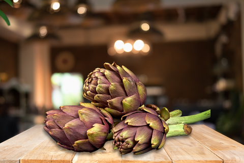 Artichokes, one of the high fiber foods available, set on the table.