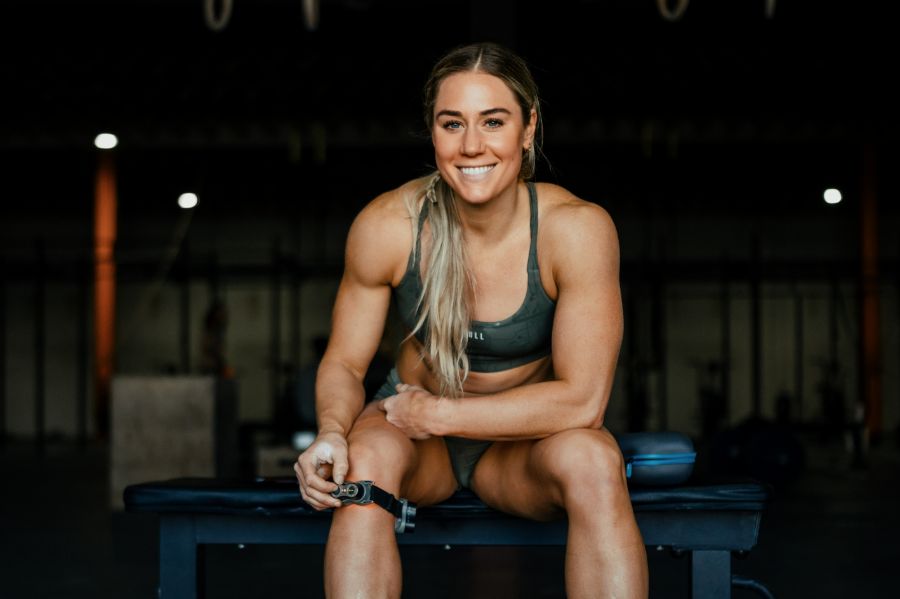 Brooke Wells with the MOVE+ Red light therapy device