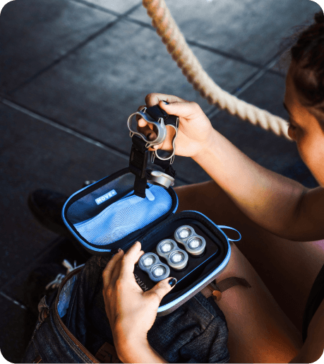 A woman unzipping her Kineon Move+ Pro device in its bag.