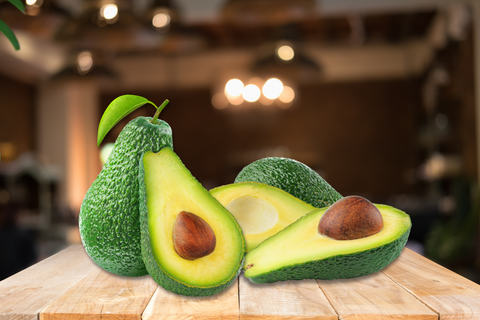 Some avocados (on of the high fiber foods) set on the table.
