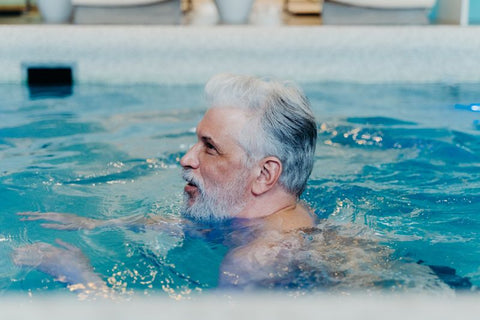 man swimming in a pool