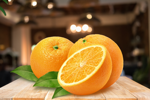 Oranges, one of the high fiber foods in the list, set on the table.