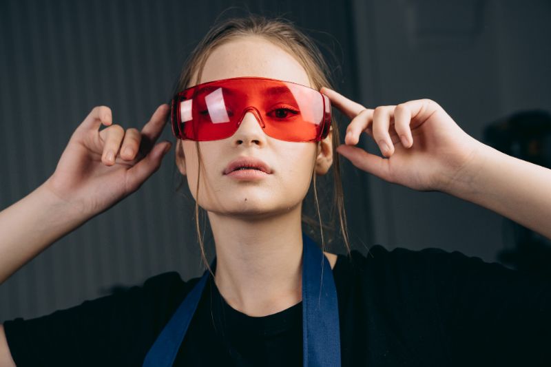 Woman wearing eye protection for red light therapy safety
