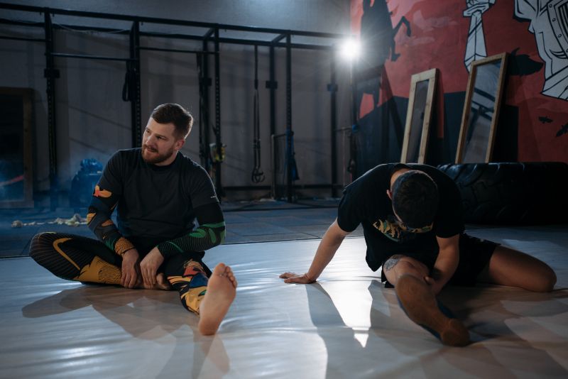 MMA fighters stretching for recovery