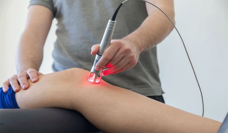 Person using red light therapy