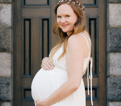 White sleeveless maternity guest dress