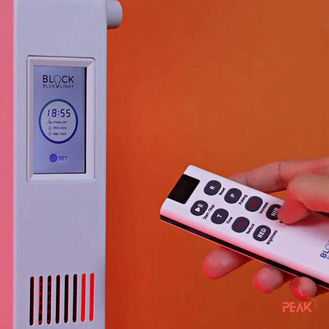 a hand pressing the buttons of the remote control