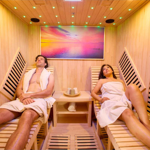 People relaxing while having an infrared sauna