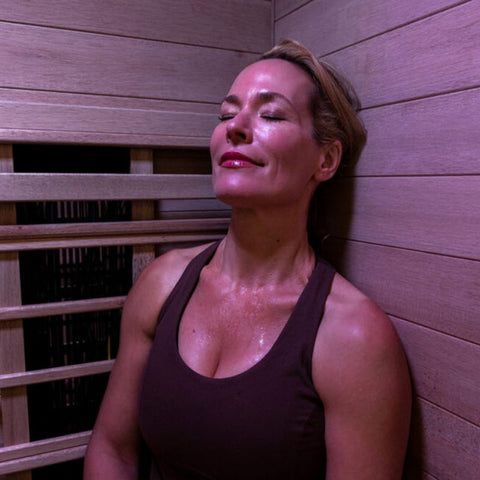 woman enjoying an infrared sauna session