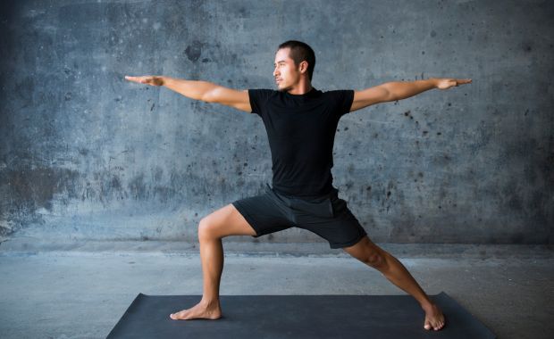 man doing yoga stretch