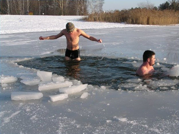 men taking an ice bath