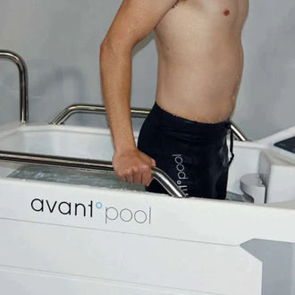man standing in an ice tub