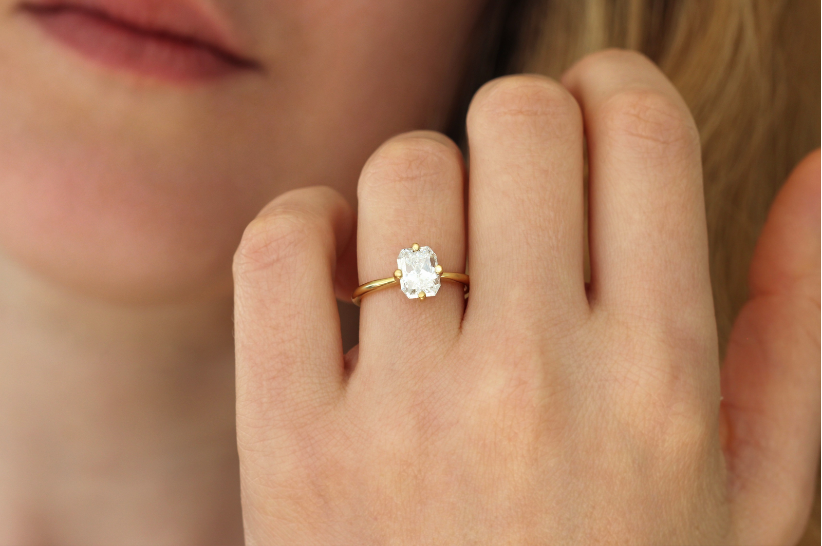 ring with two simple wedding bands and a solitaire in between