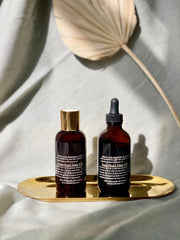 Premium Photo  Conceptual composition of essential oils moss and tree bark  on a green background oil serum for skin and hair care glass bottles of  body oil with a dropper selfcare