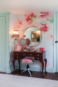 decorative pink floral wall mural on a light blue pastel wall