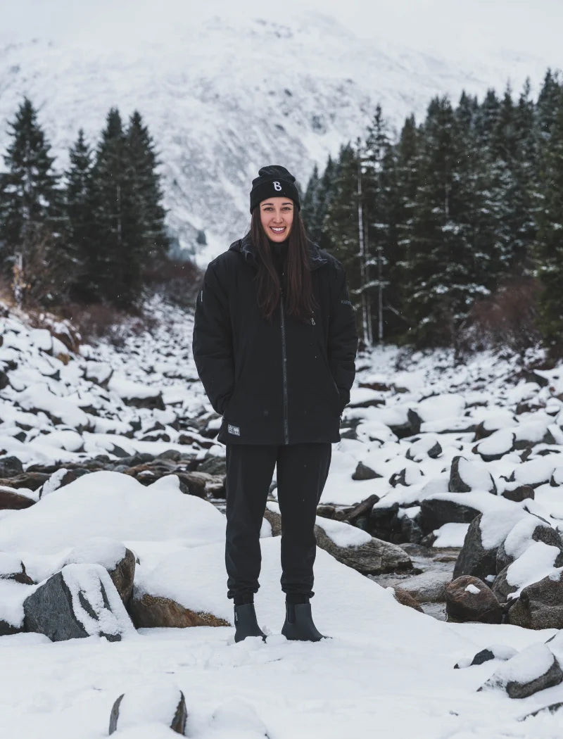 Bella wearing black boots in the icey mountains