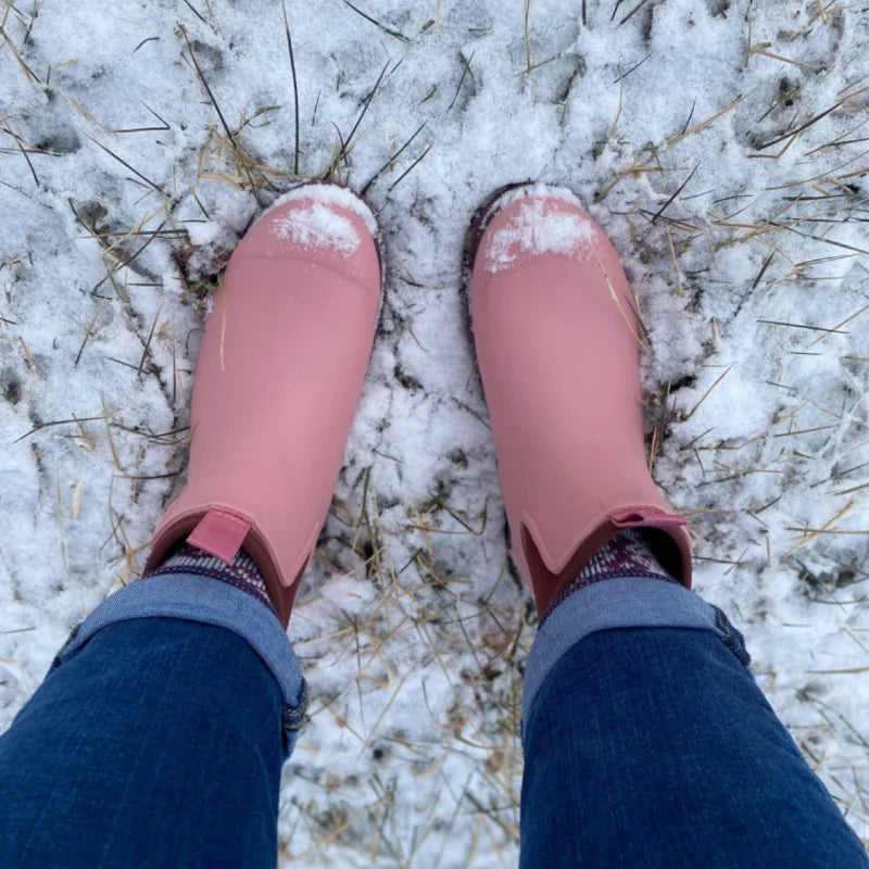 pink boots on snow