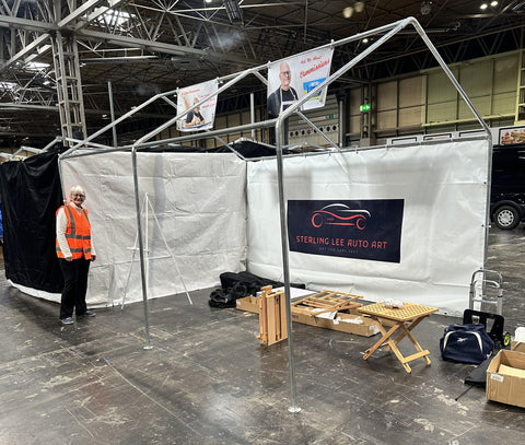 setting up art booth onsite at the NEC Classic and performance show