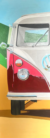 red and white vw campervan on the beach with sand and dunes and a blue sky in the sun