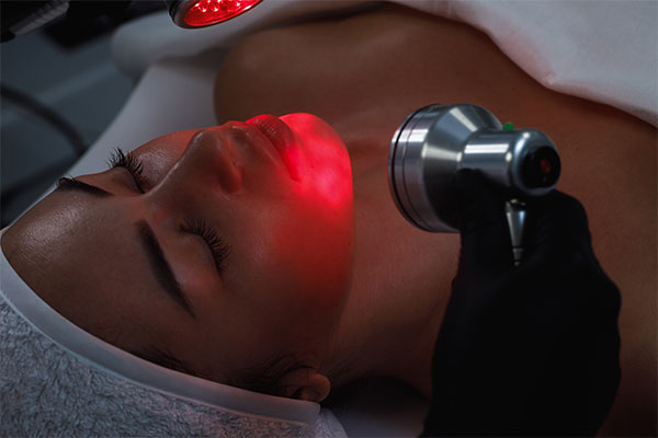 red-light-phototherapy-red-light-therapy-red-therapy-light-infrared-light-therapy-treatment-before-after-red-light-therapy-red-light-for-sleep-red-light-therapy-light-red-light-therapy-for-weight-loss-woman-in-the-salon-getting-led-red-light-therapy