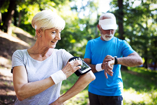seniors-running-tracking-heart-rate-monitor-progress