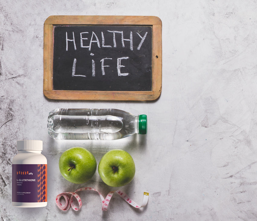 healthy-life-composition-with-apples-slate-water-bottle-nmnsify-1000mg-glutathione-supplement-bottle
