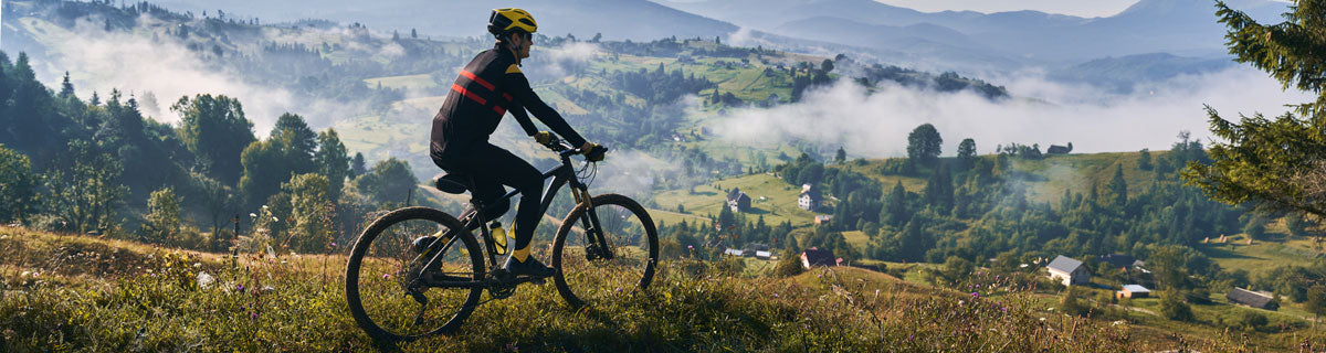 male-cyclist-riding-bicycle-mountains
