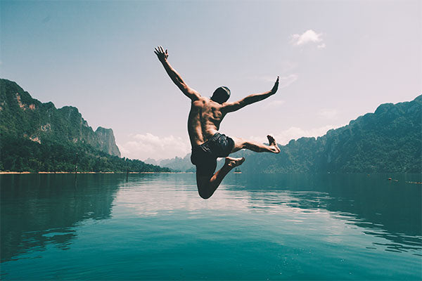 cold-water-therapy-30-day-challenge-man-happy-jumping-in-water
