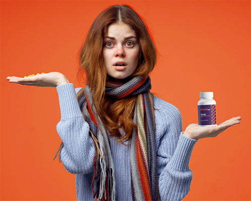 sick-woman-neck-scarf-pills-hand-isolated-orange-background