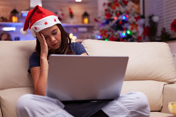 anxiety-on-christmas-anxiety-about-christmas-christmas-anxiety-woman-on-christmas-anxious-looking-at-laptop