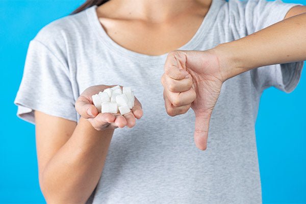 world-diabetes-day-hand-holding-sugar-cubes-thumb-down-another-hand