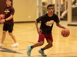 teen basketball player in training