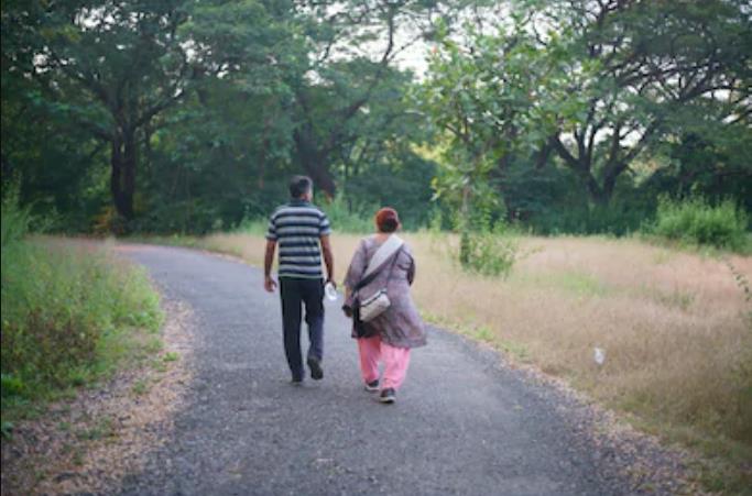 elder couple walking