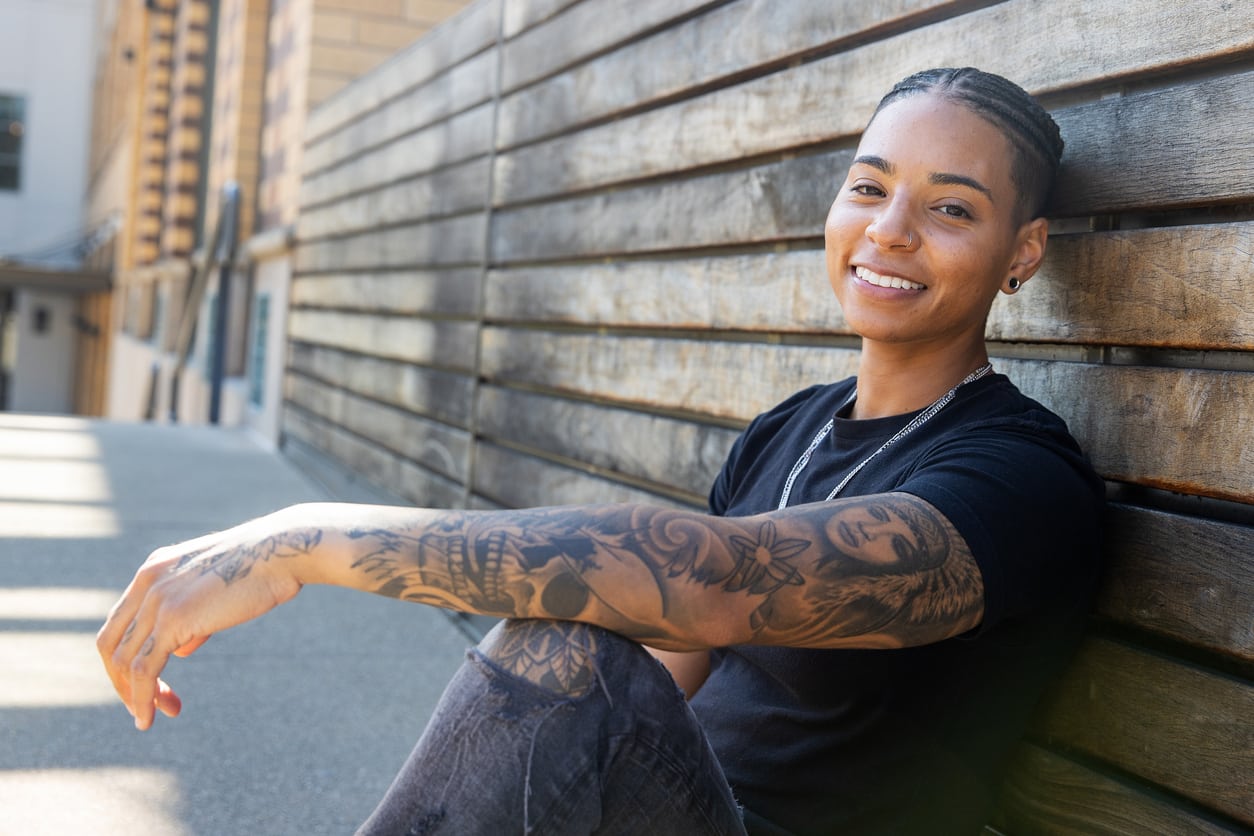 Pretty Woman with Tattoos in a Leather Chair  Stock Image  Everypixel