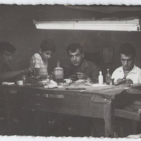 A group of men sitting at a table
