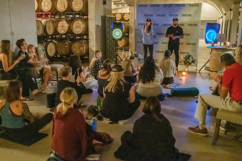 Karena Dawn and James Nicholas Kinney welcome the audience in The Cave at Slate Theory Winery World Mental Health Day